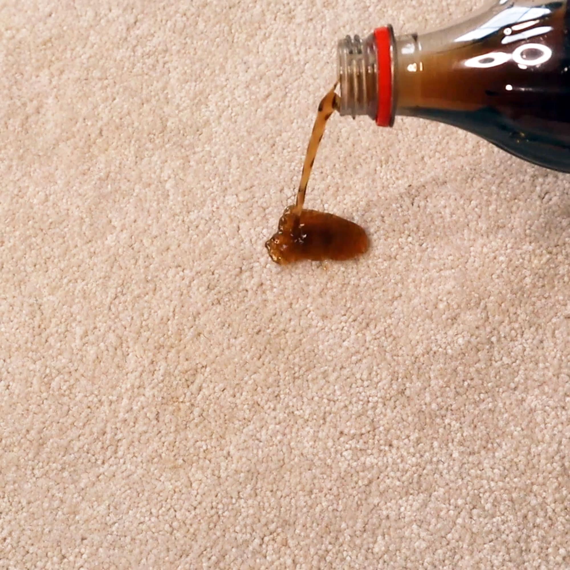 coca cola being spilled on carpet